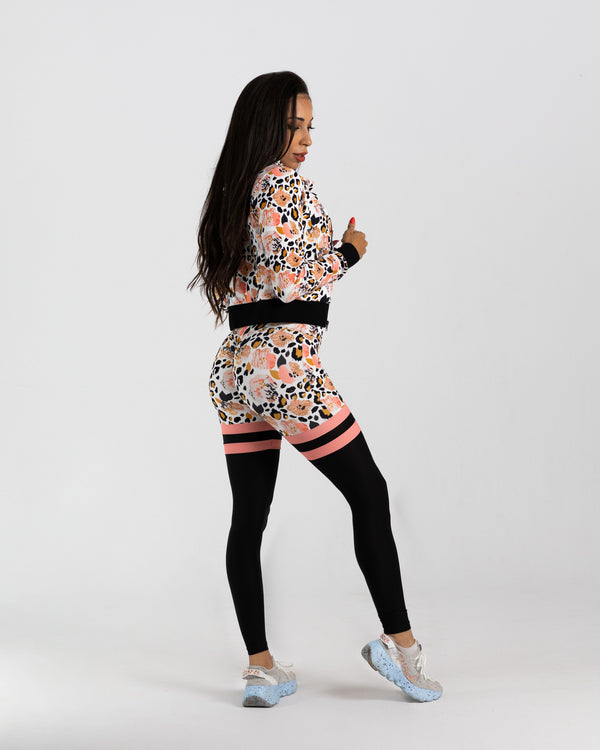 Black peach skin leggings with a multicolored floral print. Polyester and  spandex blend. One size fits most., 731632